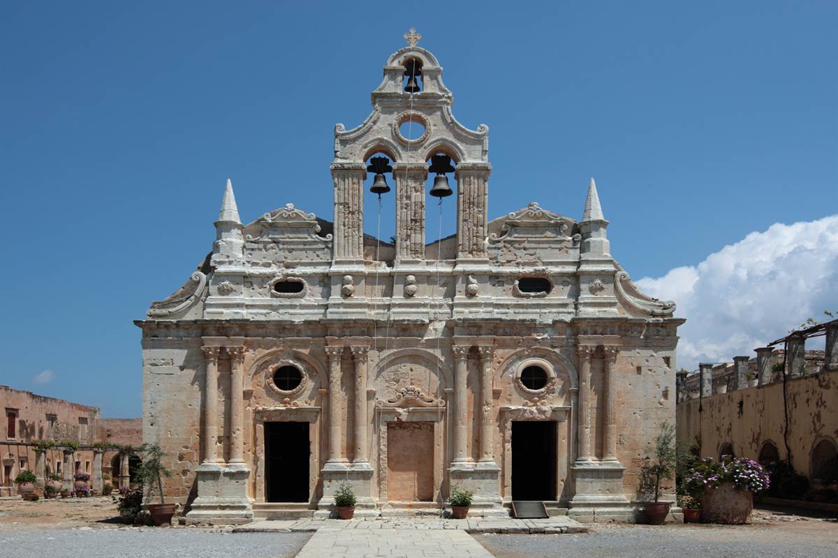 The carved stone facade and bell gable of the main church at Arkadi Monastery near Rethymno, open to visitors with Arkadi Monastery tickets