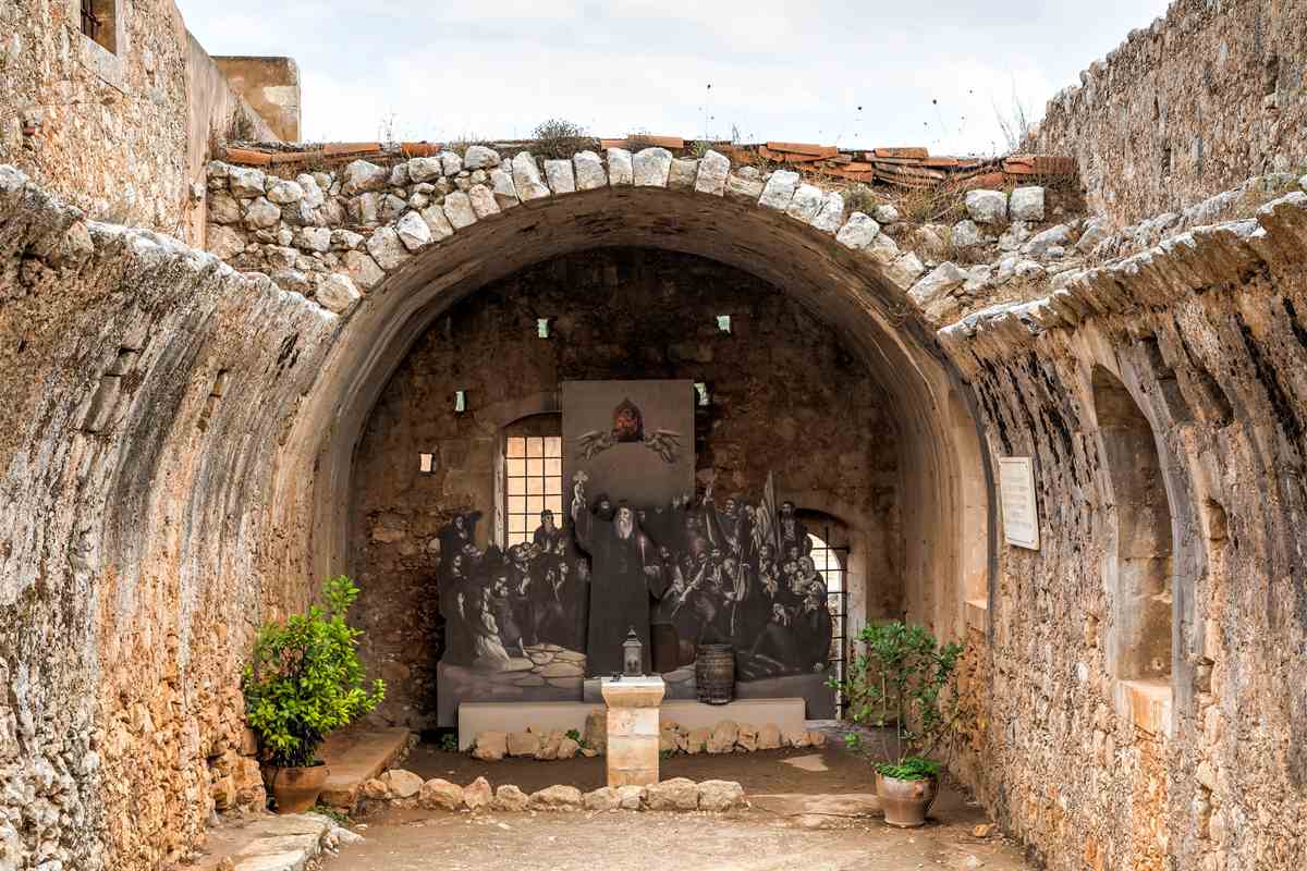 The vaulted gunpowder magazine of Arkadi Monastery with its memorial to the defenders, one of the rooms open with Arkadi Monastery tickets
