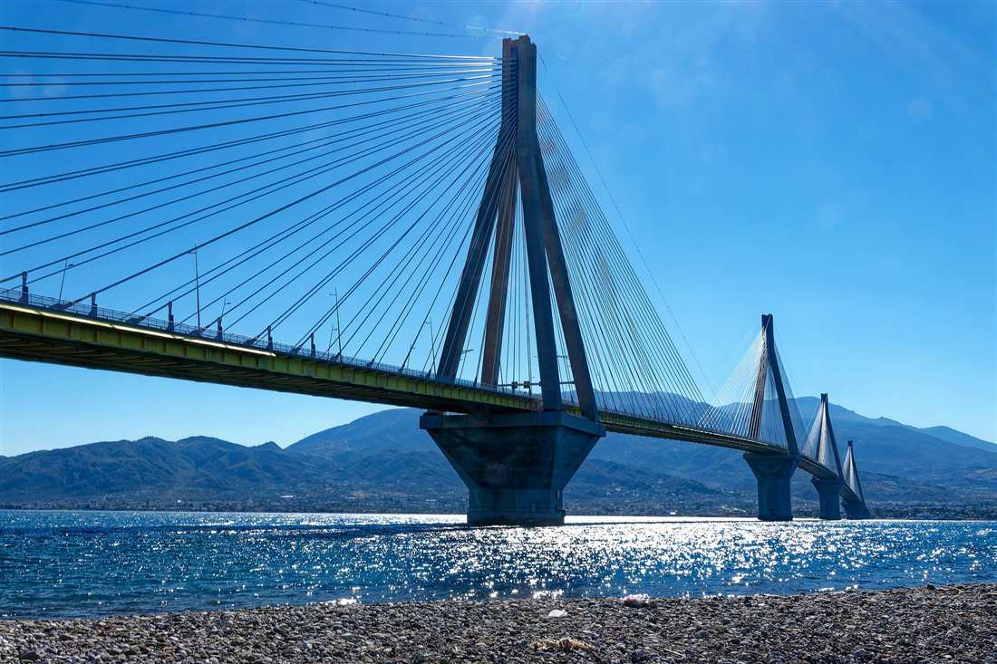 The cable-stayed Rio-Antirrio Bridge crossing the Gulf of Corinth near Patras under a clear blue sky