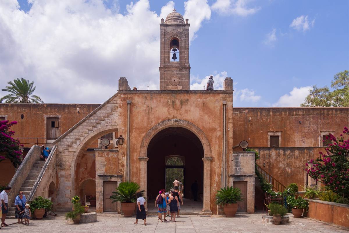 The arched gateway and bell tower of the Agia Triada Tzagarolon monastery near Chania, visited on a Chania shore excursion to the Akrotiri peninsula.