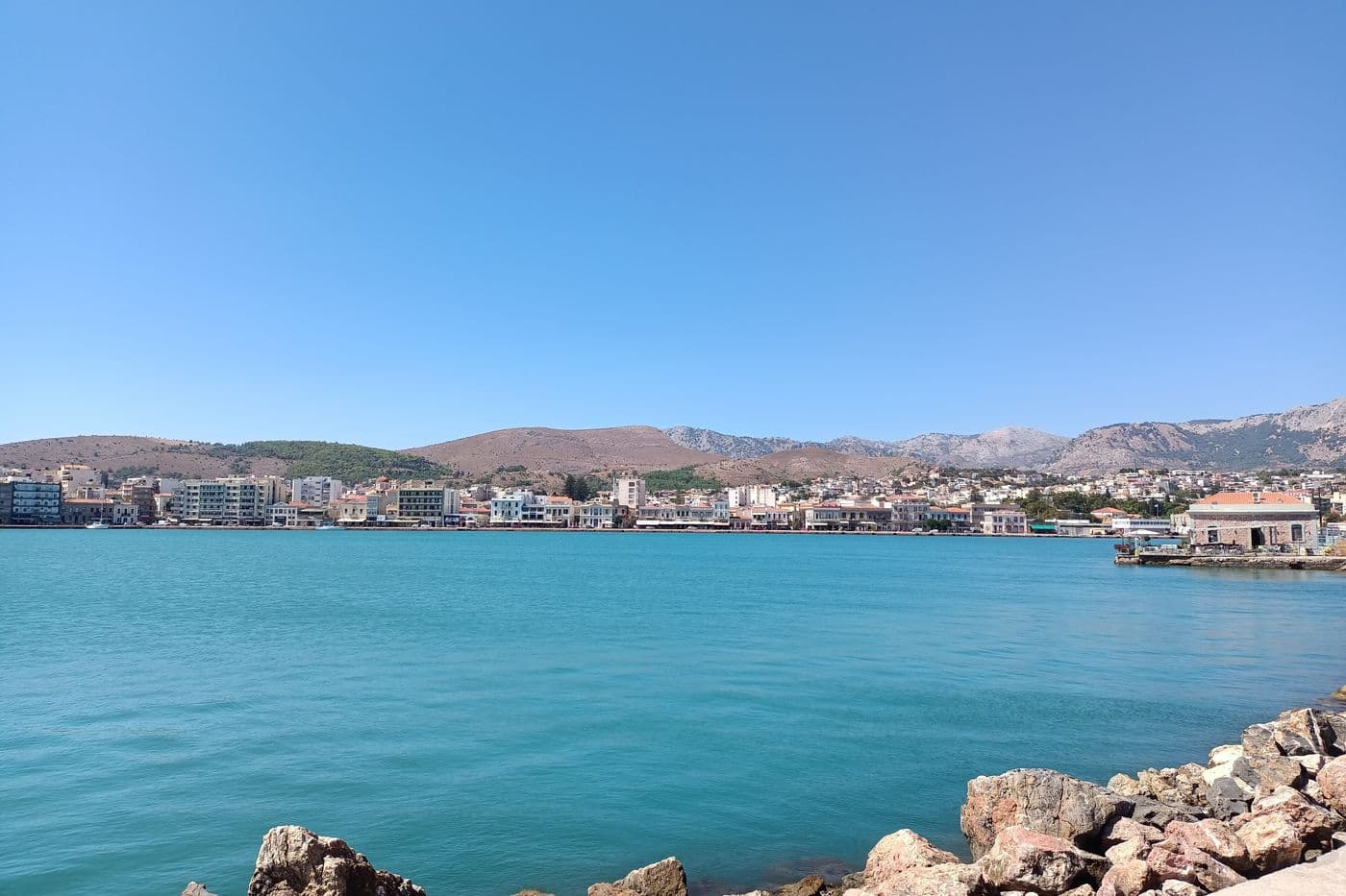 The harbour of Chios Town below the mountains, where Chios port transfers meet ferry passengers