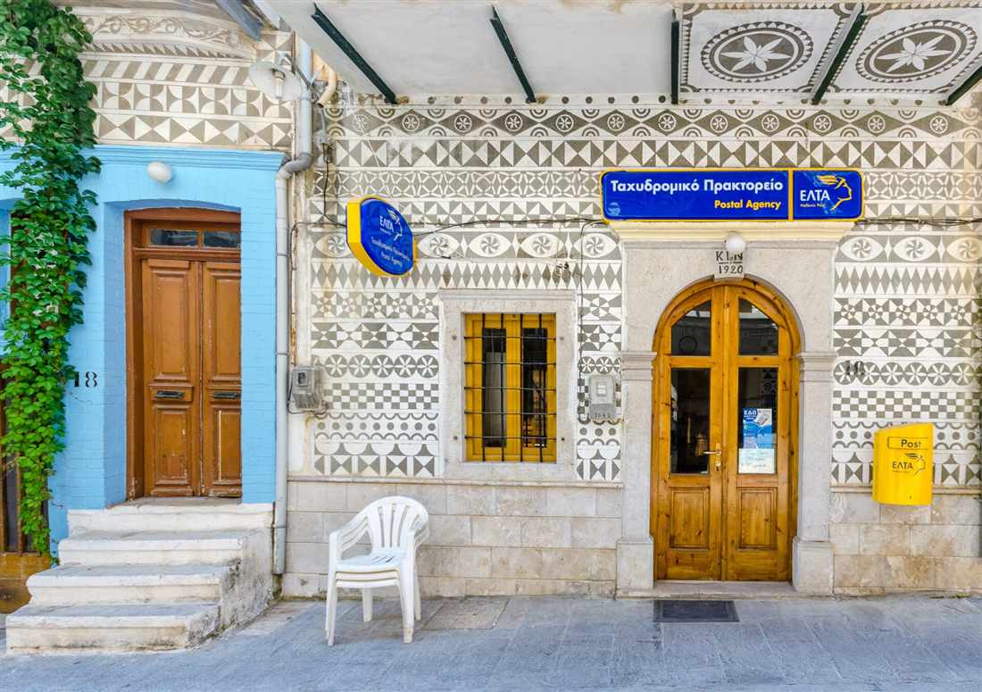 The black-and-white xysta patterns on the post office facade in Pyrgi village on Chios