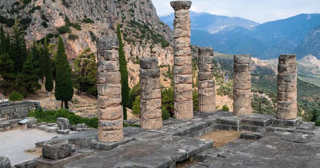 Standing column drums of the Temple of Apollo at Delphi, on the stone platform below the cliffs of Parnassus.