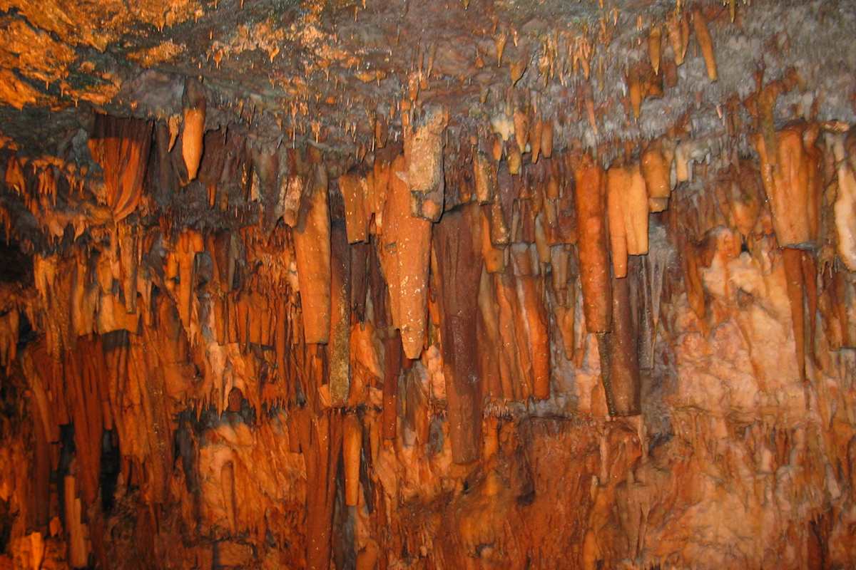 Rows of orange stalactites hang from the ceiling of Drogarati Cave near Sami, the formations visitors see with Drogarati Cave tickets