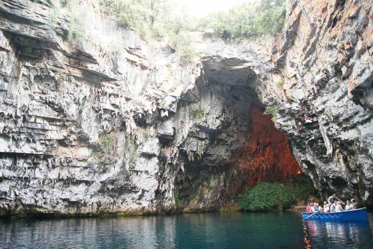 A rowing boat on the lake of nearby Melissani Cave, the second cave many visitors pair with Drogarati Cave tickets