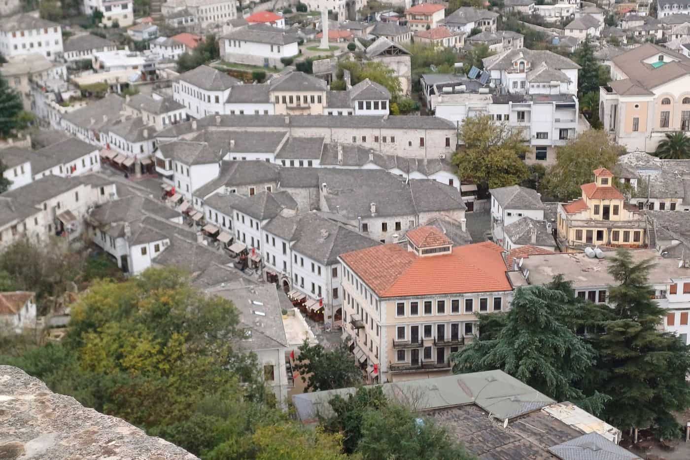 Gjirokaster tours look down on the stone roofs of the old bazaar from the castle of Gjirokaster