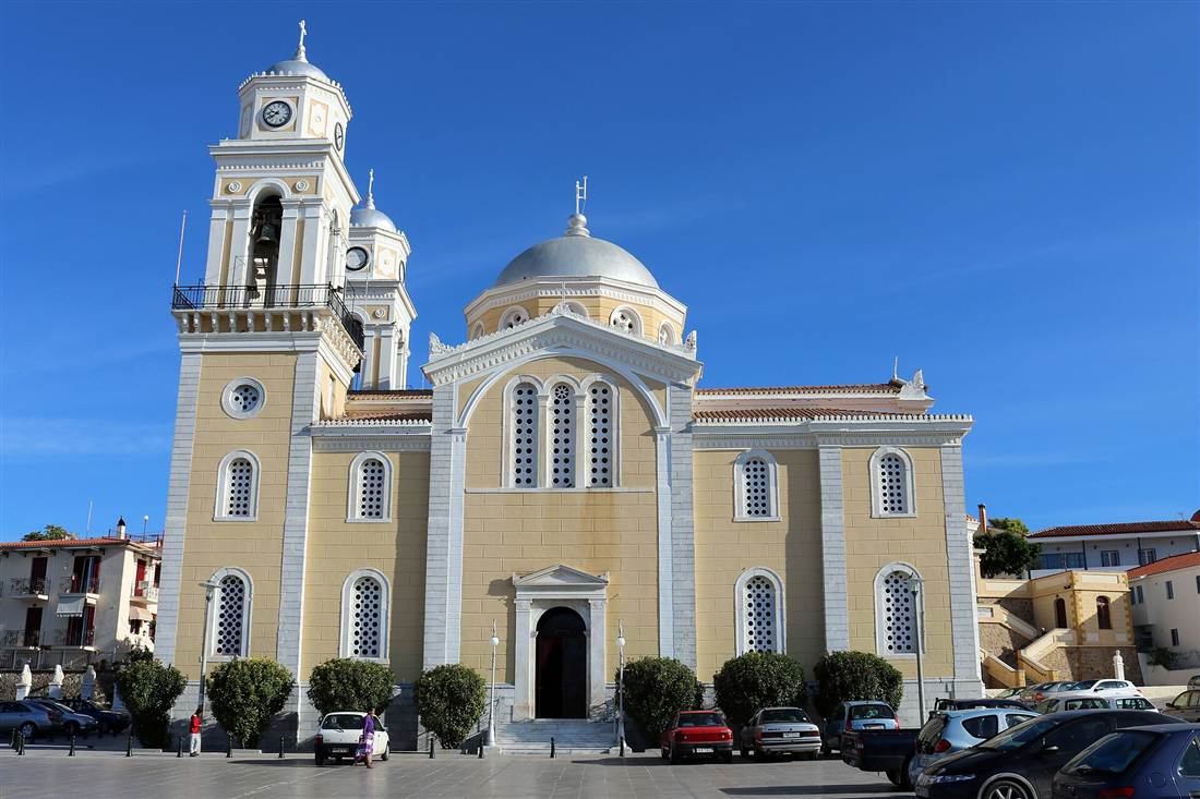 The Ypapanti cathedral in the old town of Kalamata with its twin bell towers and domes under a clear blue sky
