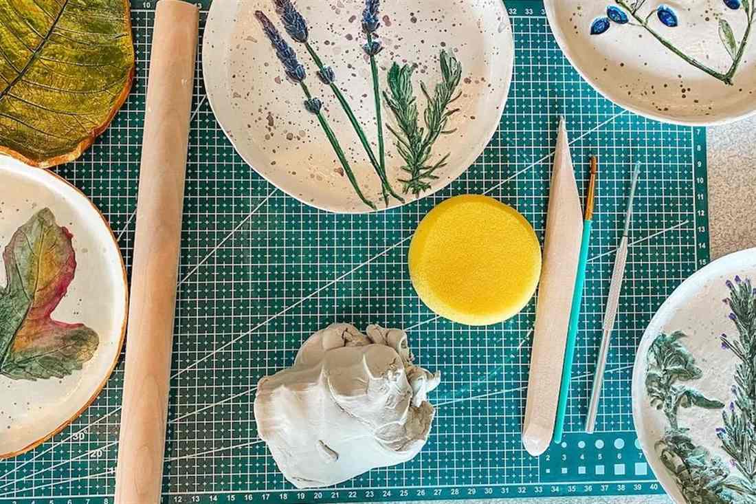 Clay plates pressed with lavender, rosemary and fig leaves, the work made in a Karpathos pottery class.