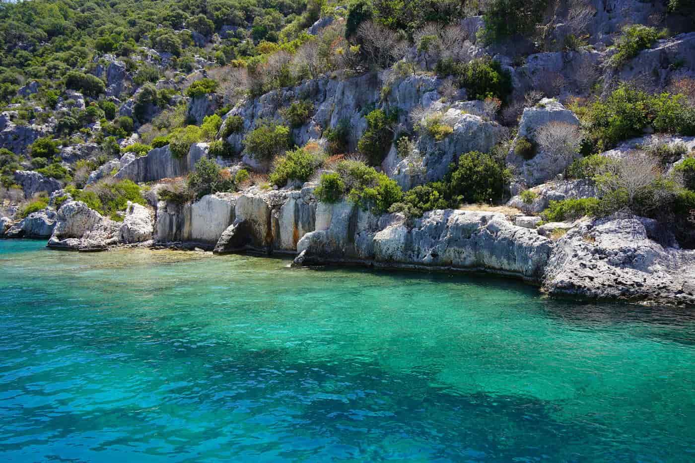 Kas tours sail over the clear water at the sunken city ruins of Kekova