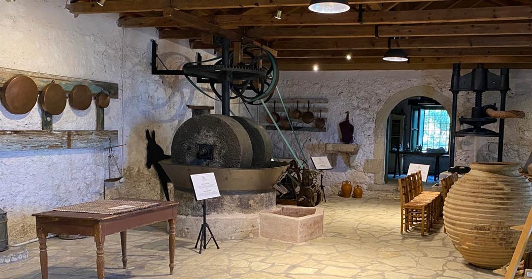 The old stone olive mill and wooden presses inside the Fabbrica olive museum on Lefkada.