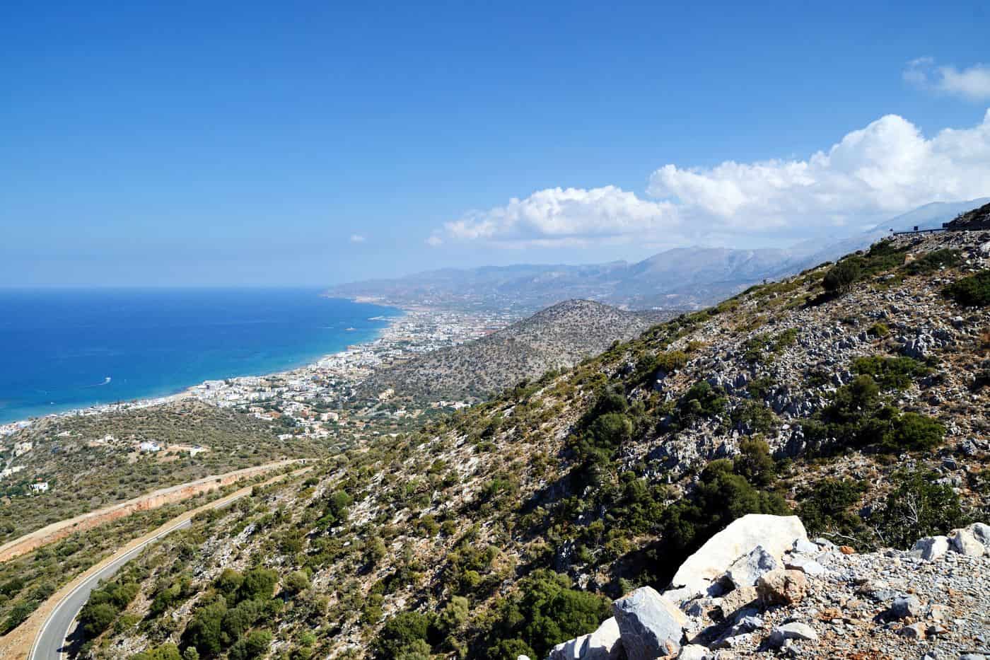 The bay of Malia from the hills, with the resort strip that Malia transfers serve