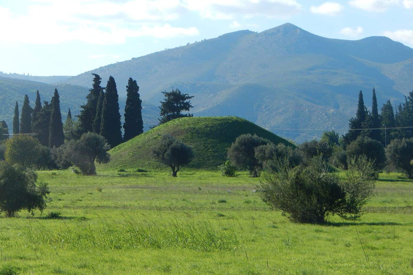 Marathon tours stop at the Tomb of the Athenians, the burial mound on the plain of Marathon