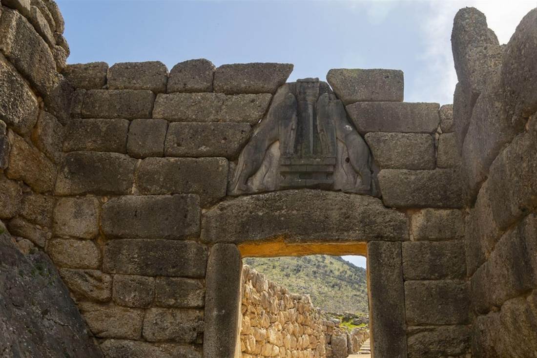 The Lion Gate of Mycenae, two carved stone lions above a massive lintel set in walls of huge limestone blocks.