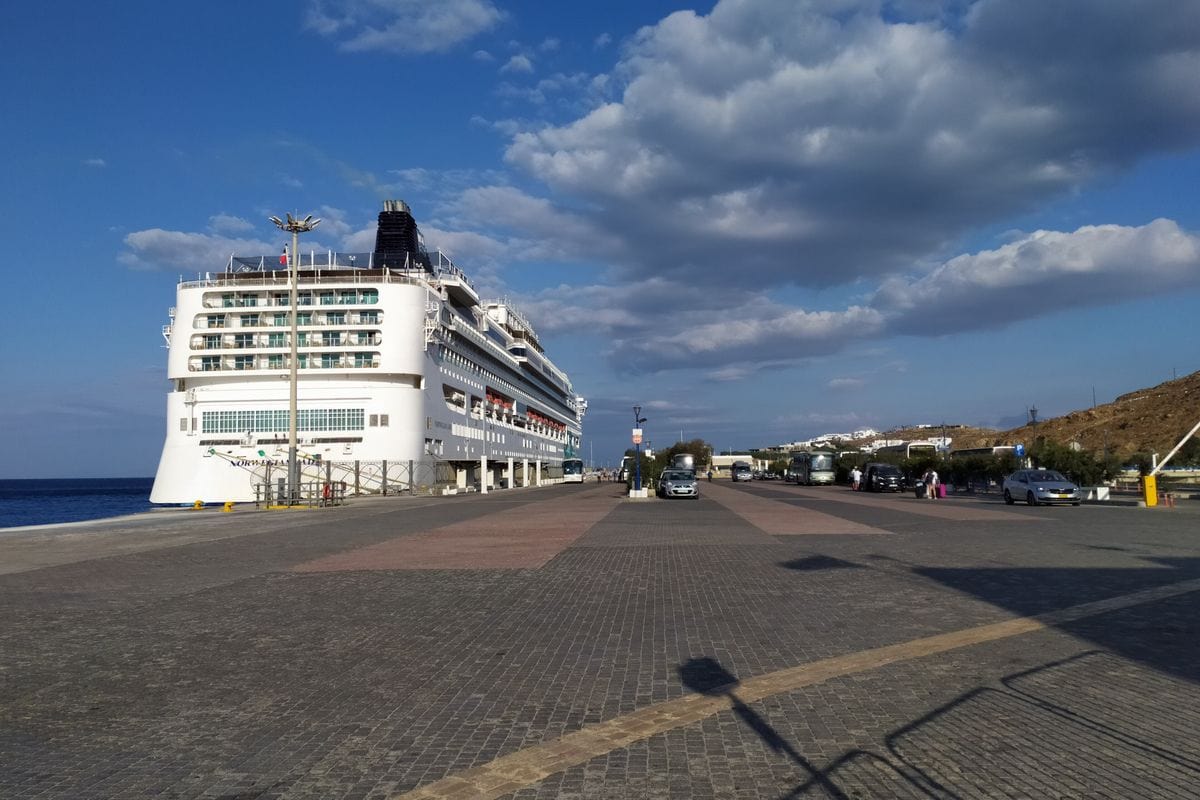 A cruise ship at the New Port, where Mykonos port transfers meet passengers