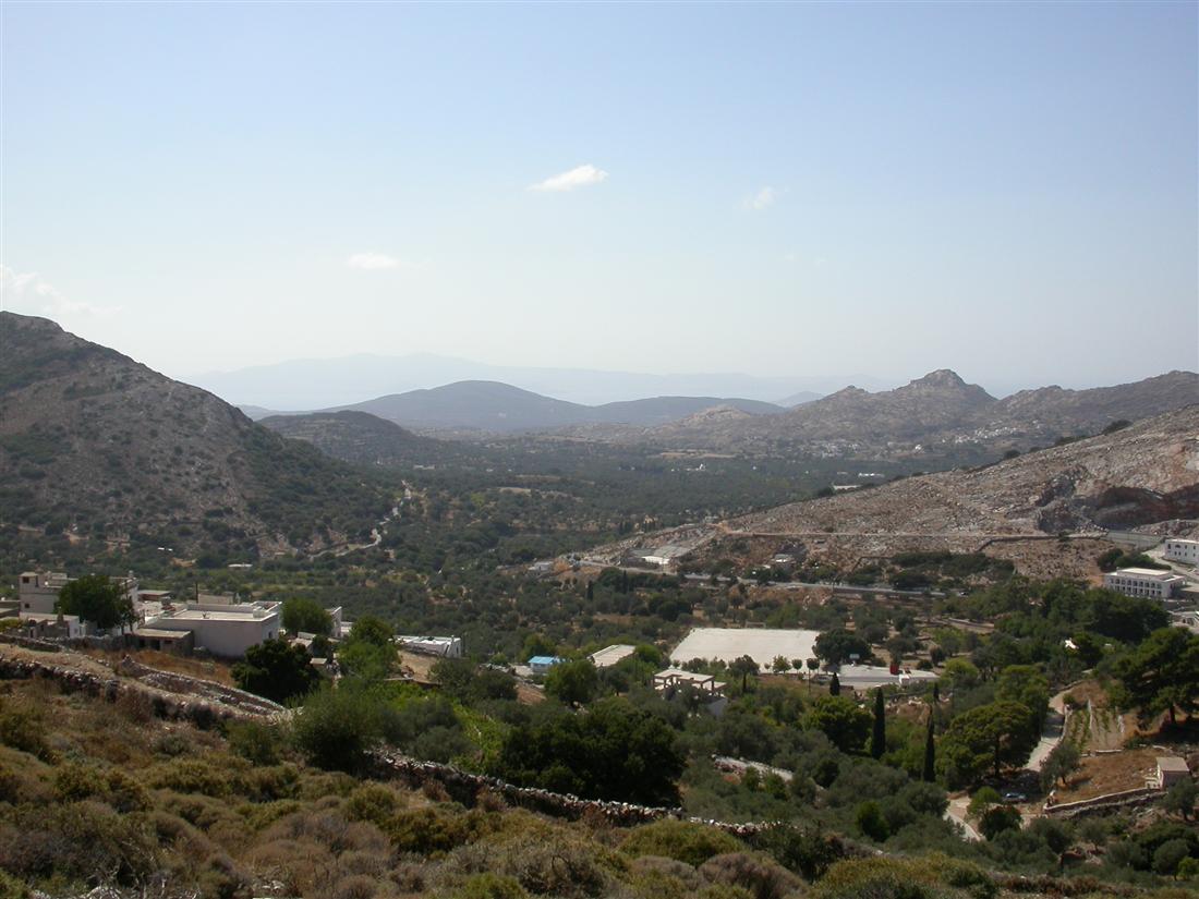The green Tragea valley of central Naxos with its olive groves and farm plots below the mountains, the setting of a Naxos farm tour.
