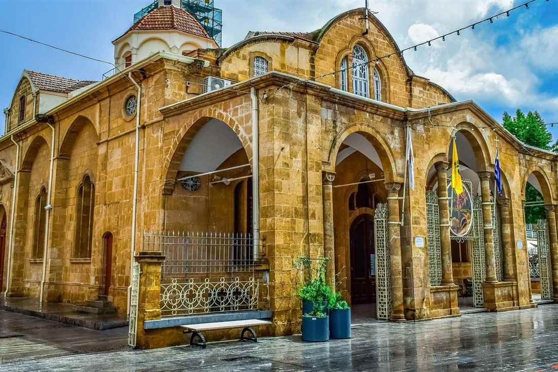 Sandstone Faneromeni church in Nicosia old town with arched porch and pointed gables