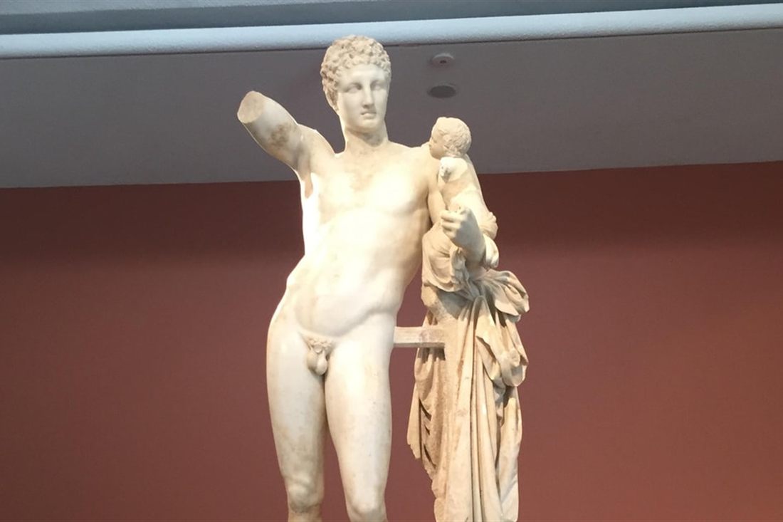 The marble statue of Hermes holding the infant Dionysus, the Hermes of Praxiteles, in the Archaeological Museum of Olympia.