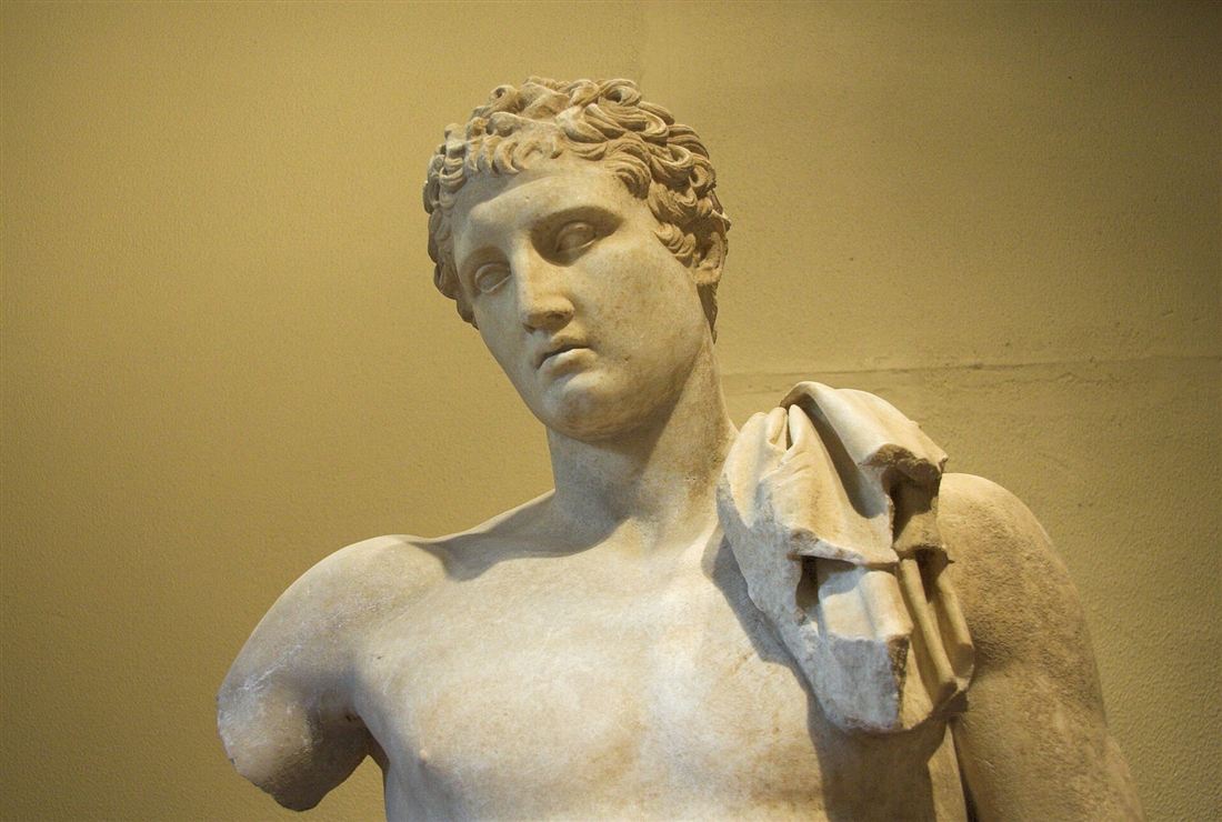 The marble Hermes of Praxiteles in the Archaeological Museum of Olympia, the statue groups see on an Olympia shore excursion.