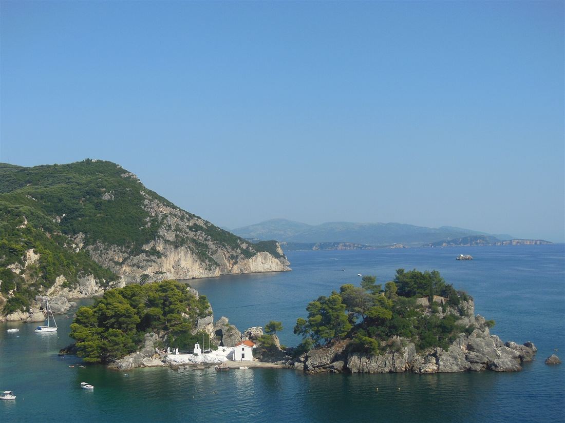 The Panagia islet with its white chapel in the bay off Kryoneri beach in Parga.