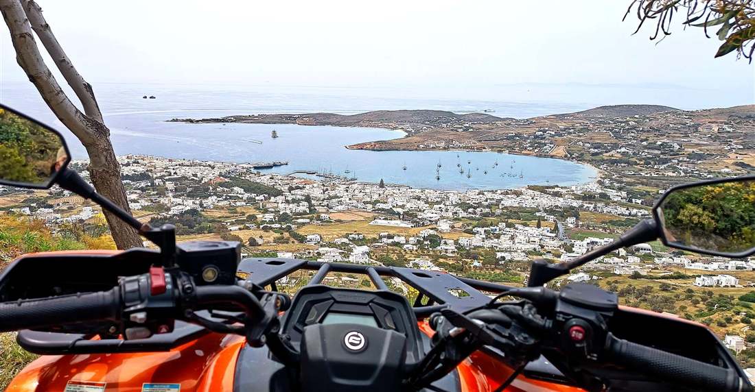 The bay of Parikia seen from the handlebars of a quad bike on a hillside track on Paros