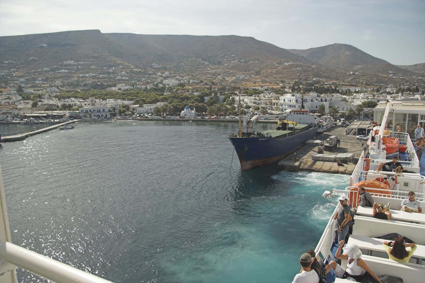 A ferry docking at Parikia, the port where Paros port transfers meet arriving passengers