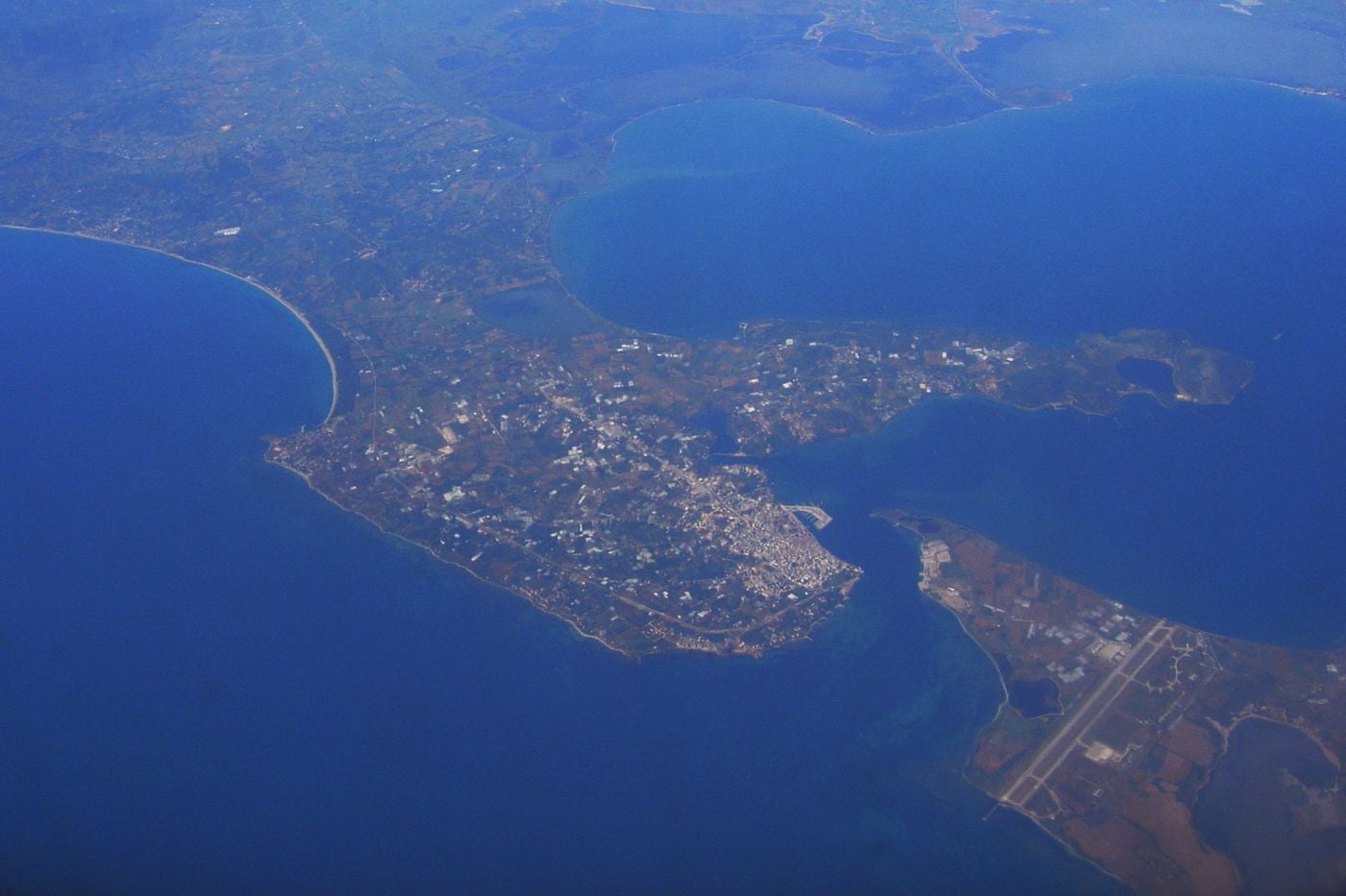 Preveza and the Aktion airport runway across the strait from the air, the route of Preveza airport transfers