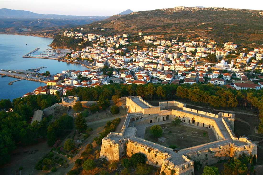 Aerial view of the hexagonal Niokastro fortress above Pylos, with the town, its harbour and Navarino Bay beyond.