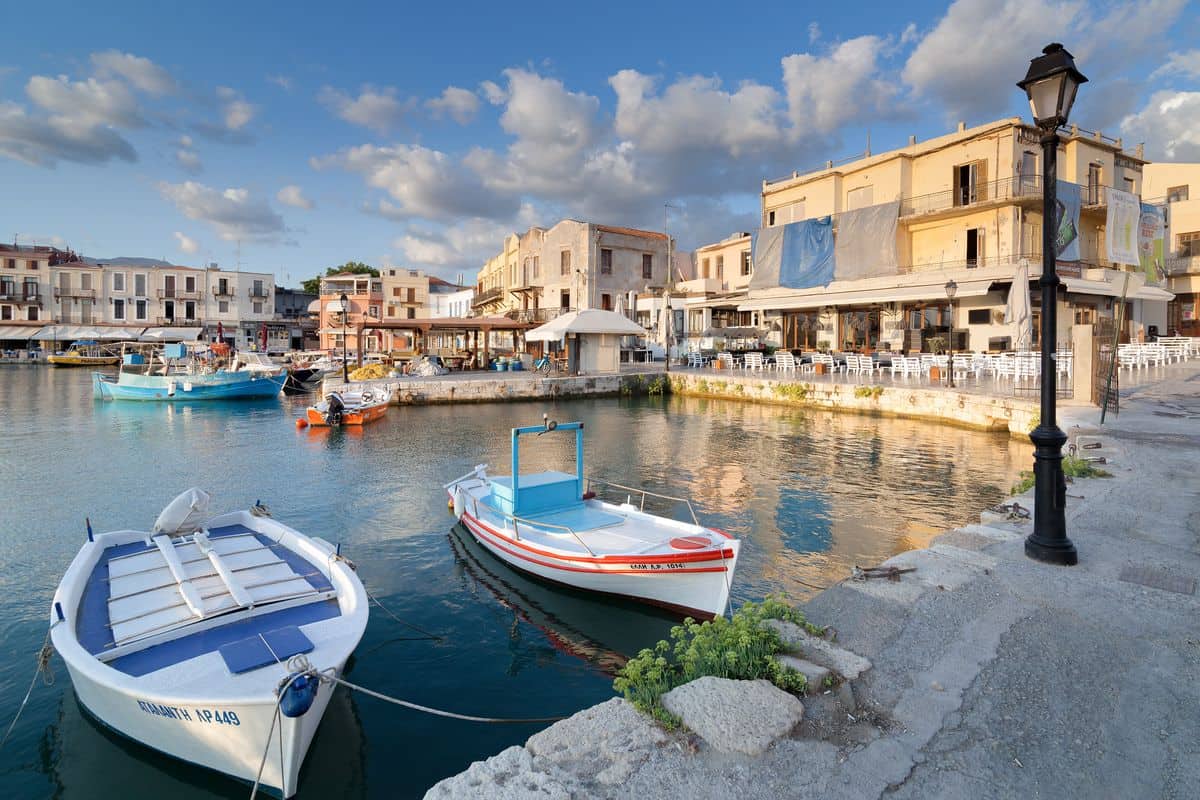 Fishing boats in the old Venetian harbour of Rethymno, a short walk from the town quay used by Rethymno port transfers