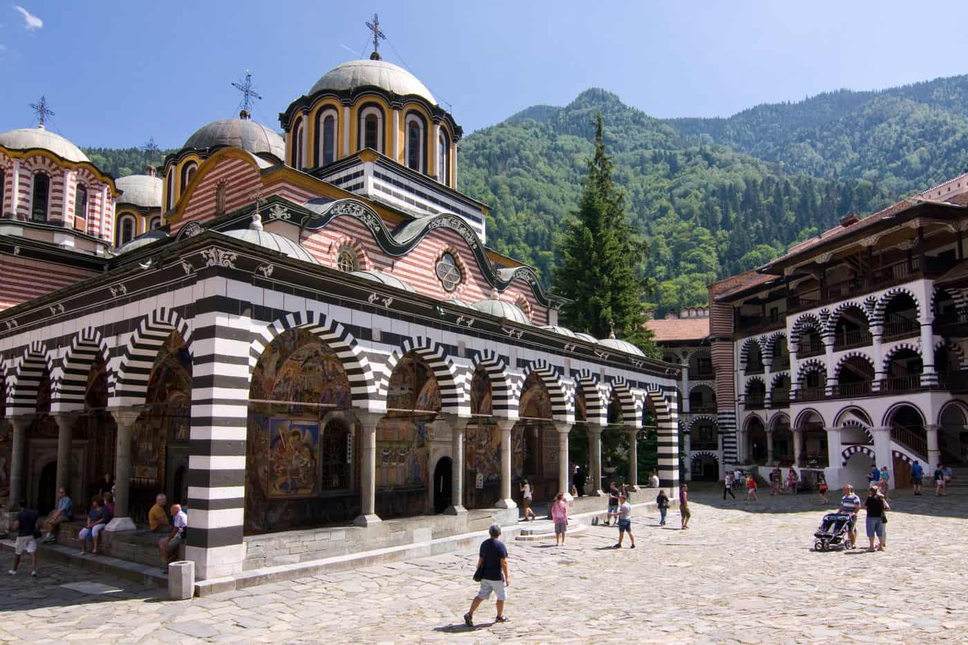 Rila Monastery tours reach the main church and its striped arcades in the courtyard of the Rila Monastery