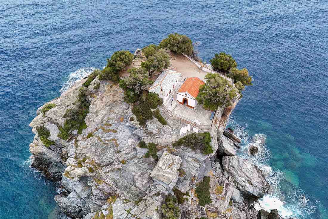Agios Ioannis Kastri chapel on its rock above the sea on Skopelos, seen from above