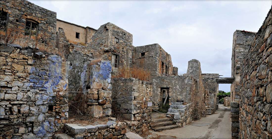 The roofless stone houses along the main street of the old village on Spinalonga, the route of a Spinalonga guided tour.