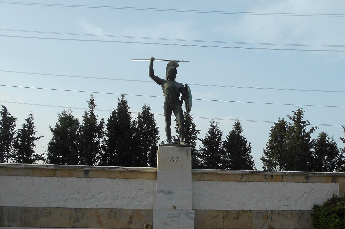 Thermopylae tours stop at the Leonidas monument, the bronze statue of the Spartan king above the words Molon Labe
