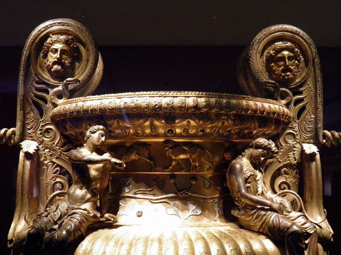 The gilded Derveni krater with Dionysus and Ariadne on its shoulder in the Archaeological Museum, a highlight of a Thessaloniki mythology tour.